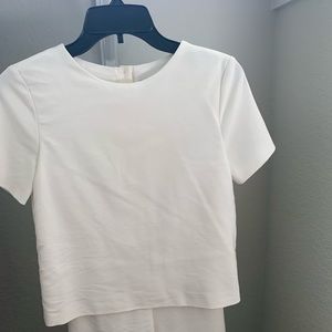 White Zara Romper with button back.